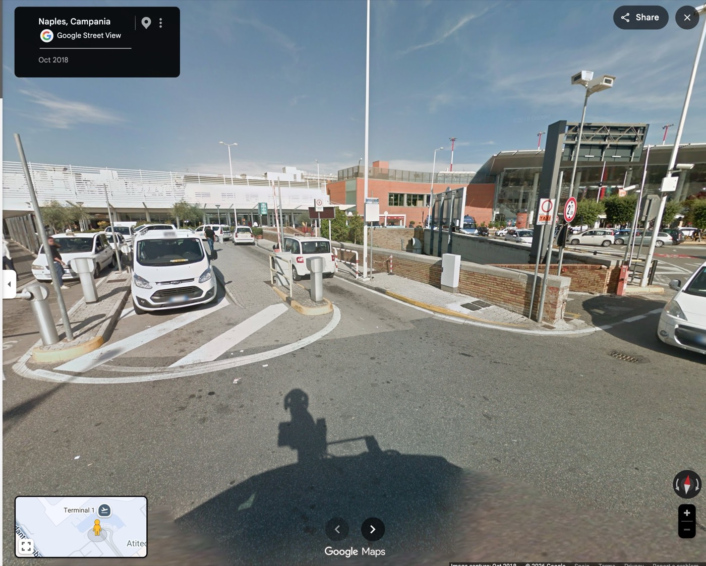 Official white taxi rank outside Naples airport arrivals